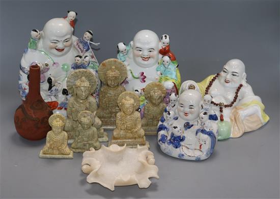 Four Chinese porcelain figures of Budai, seven soapstone carvings and a Japanese bottle vase